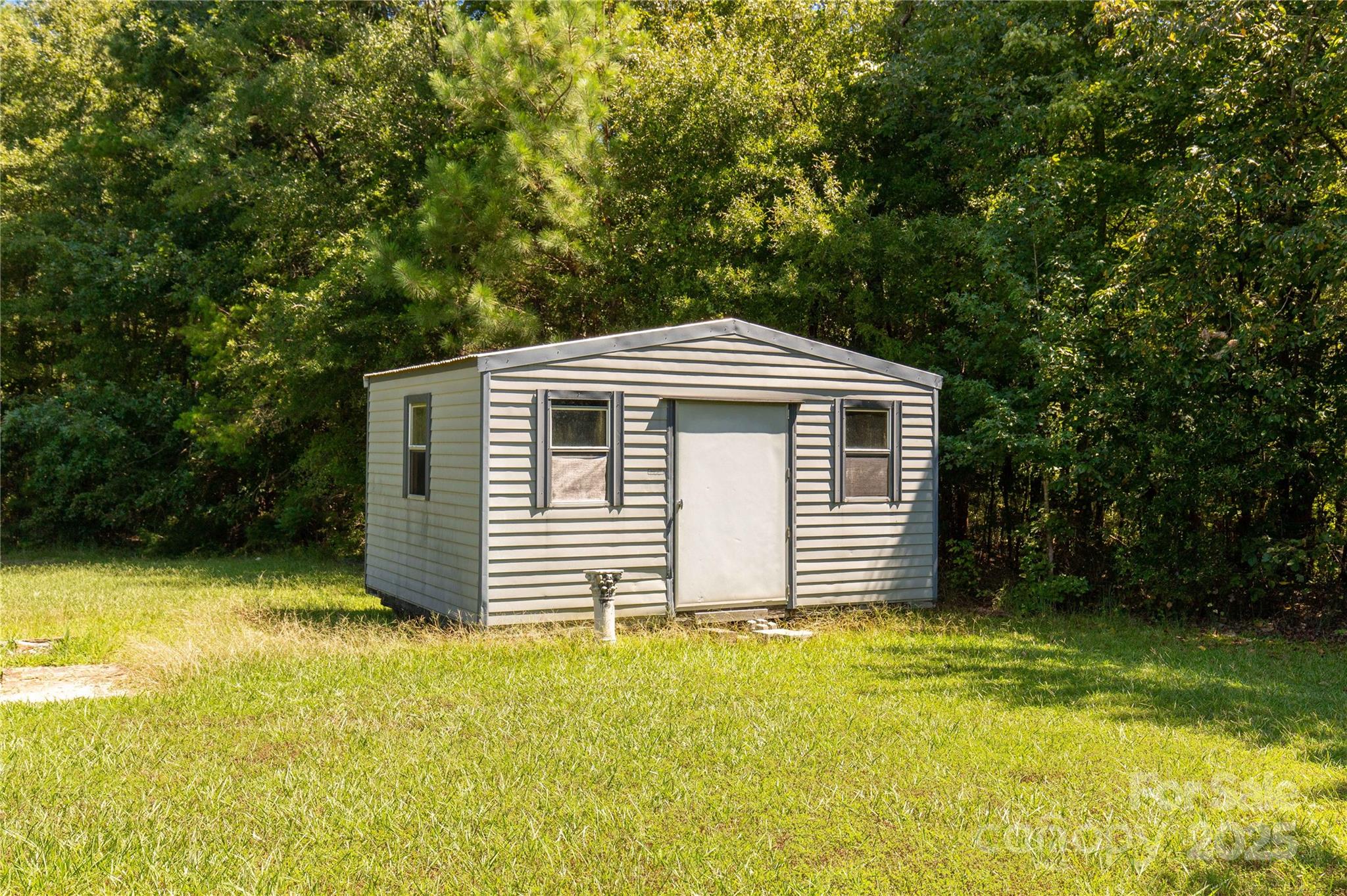 4331 Palmer Lloyd Road, Unit 11 Lancaster, SC 29720 - Photo 24 of 36 a front view of a house with a yard