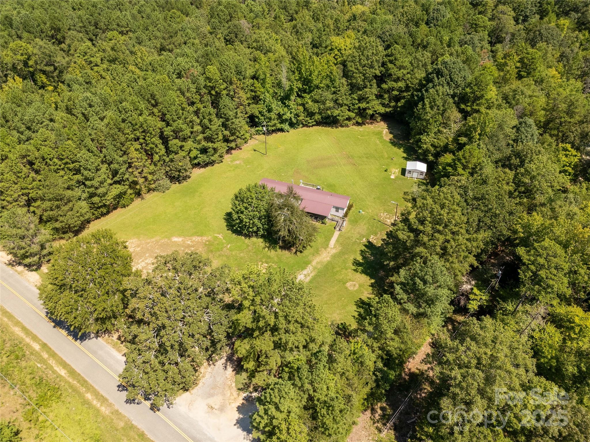 4331 Palmer Lloyd Road, Unit 11 Lancaster, SC 29720 - Photo 25 of 36 a view of a lake with a tree in the background