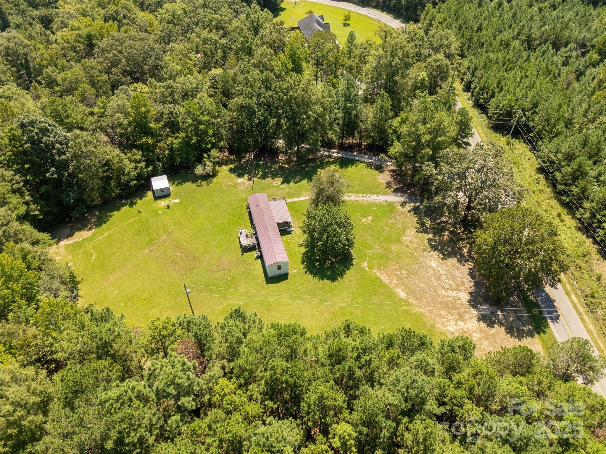 4331 Palmer Lloyd Road, Unit 11 Lancaster, SC 29720 - Photo 28 of 36 a view of a lake with a yard