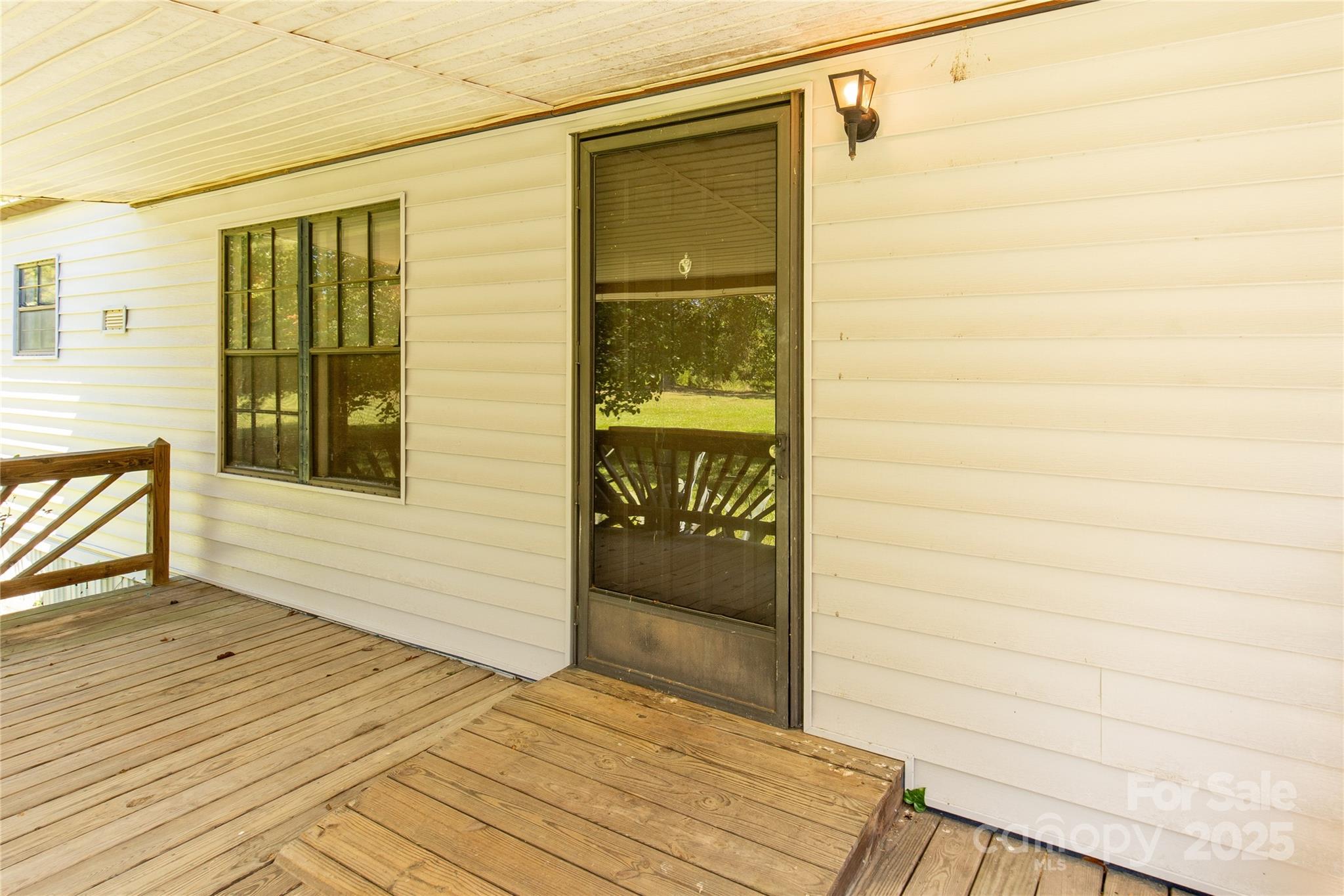 4331 Palmer Lloyd Road, Unit 11 Lancaster, SC 29720 - Photo 3 of 36 a view of a porch with a door and wooden floor