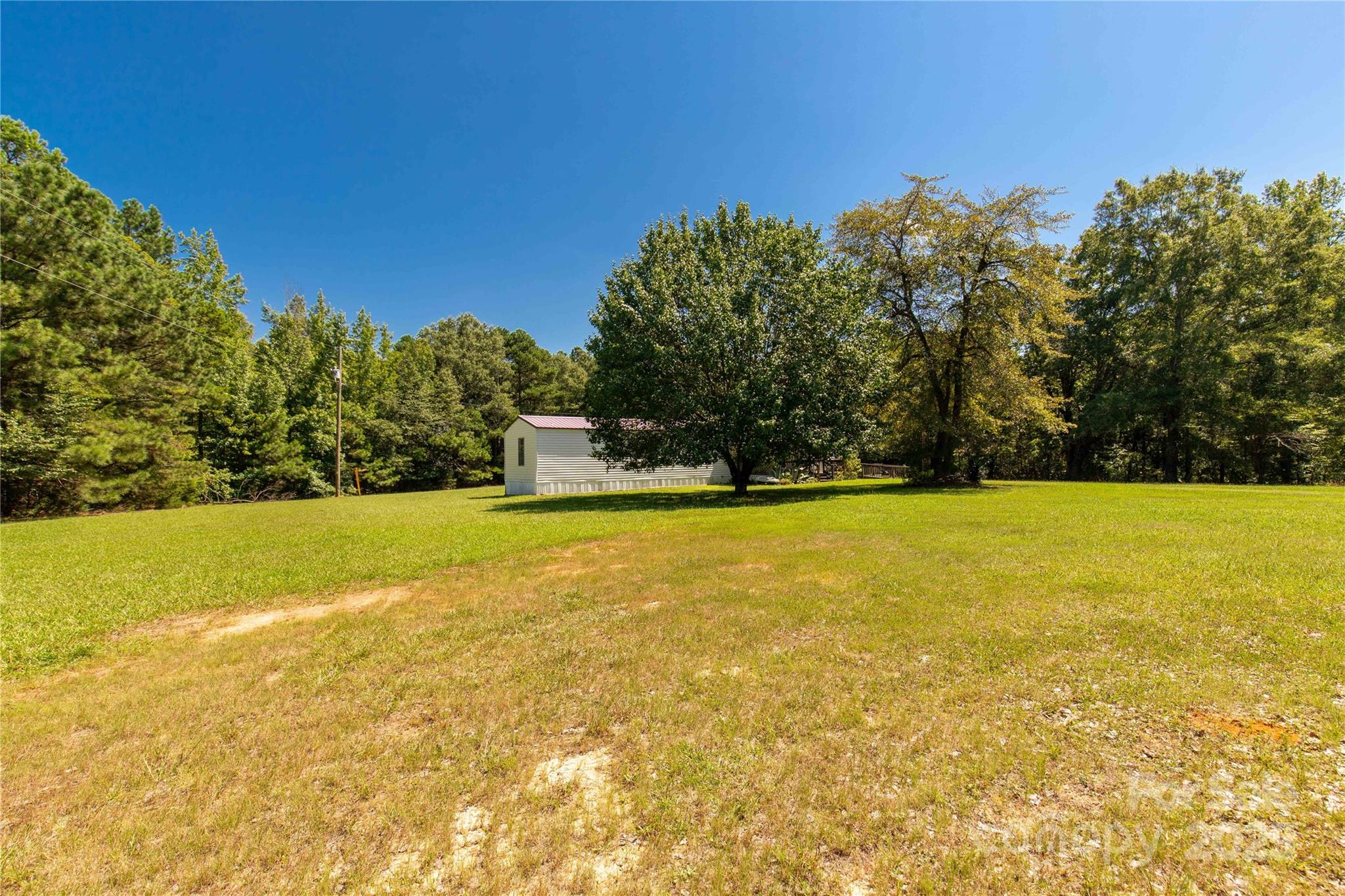 4331 Palmer Lloyd Road, Unit 11 Lancaster, SC 29720 - Photo 36 of 36 a view of yard and swimming pool with an outdoor space and seating area