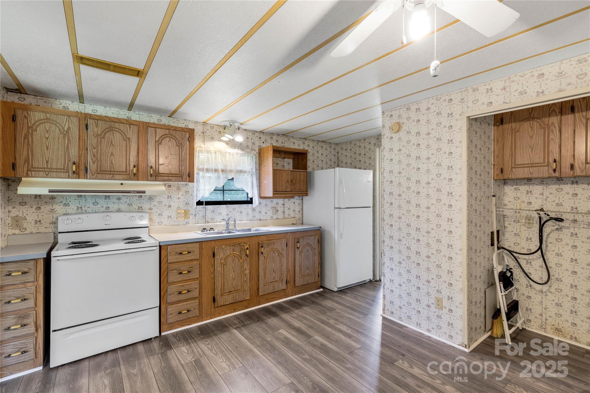 4331 Palmer Lloyd Road, Unit 11 Lancaster, SC 29720 - Photo 7 of 36 a kitchen with cabinets a sink and appliances
