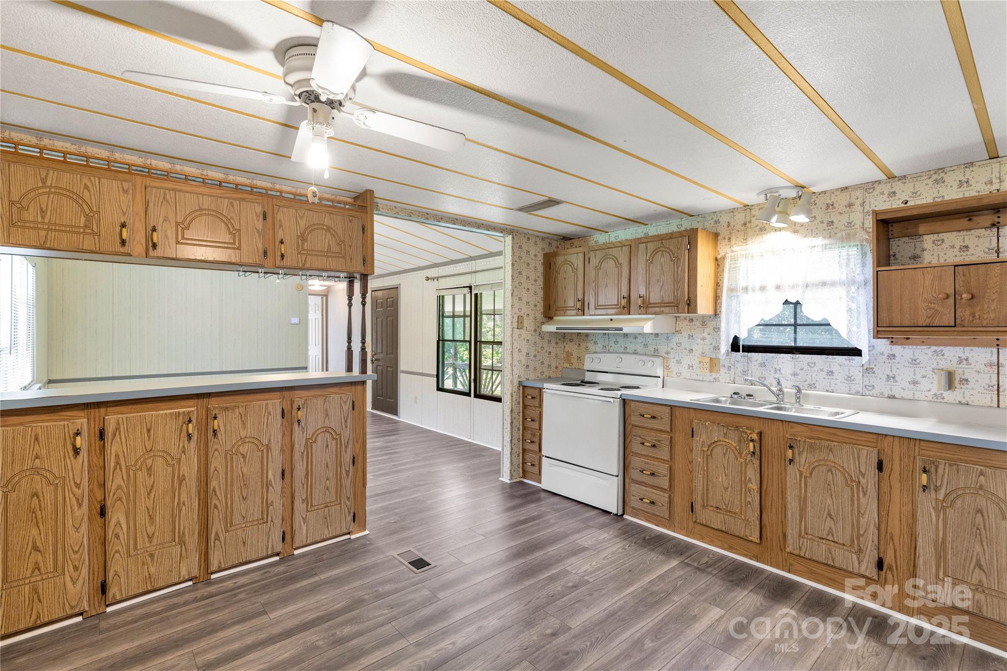 4331 Palmer Lloyd Road, Unit 11 Lancaster, SC 29720 - Photo 9 of 36 a view of a kitchen with a sink and wooden floor