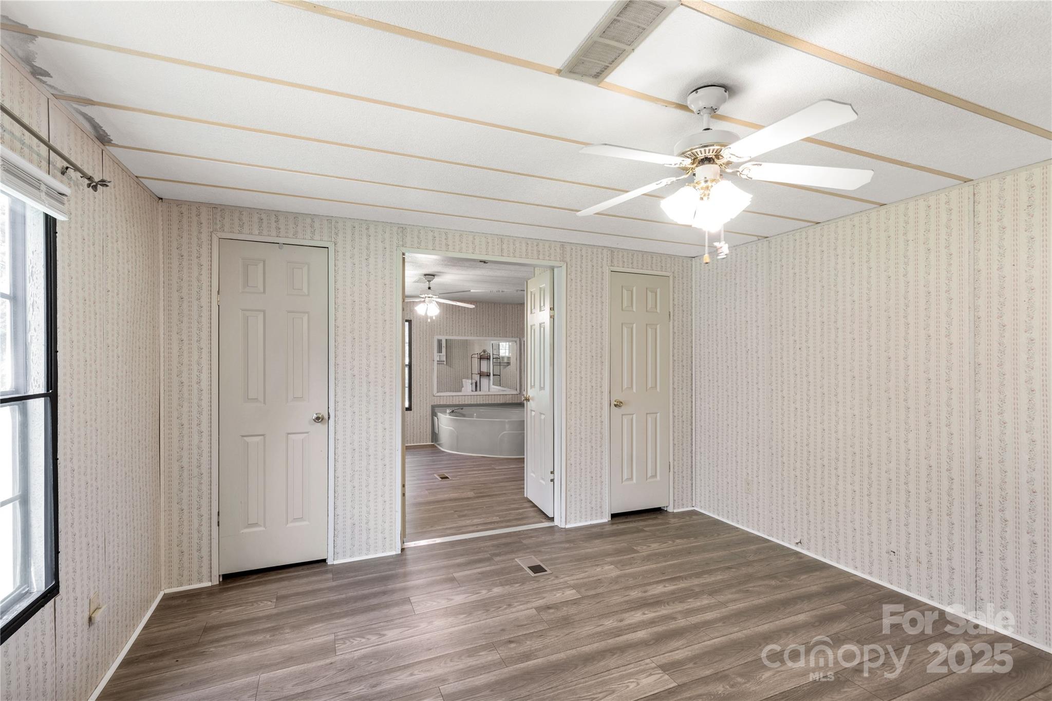 4331 Palmer Lloyd Road, Unit 11 Lancaster, SC 29720 - Photo 10 of 36 wooden floor in an empty room with a window