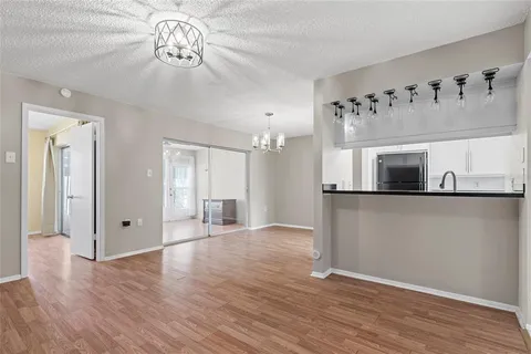 a view of a livingroom with wooden floor