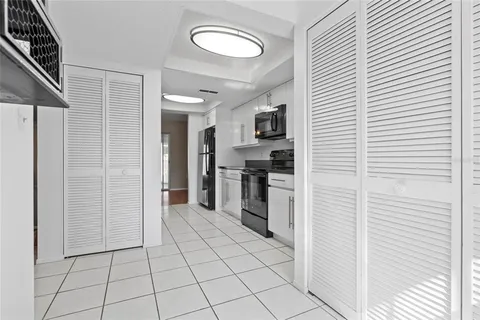 a view of a kitchen from the hallway