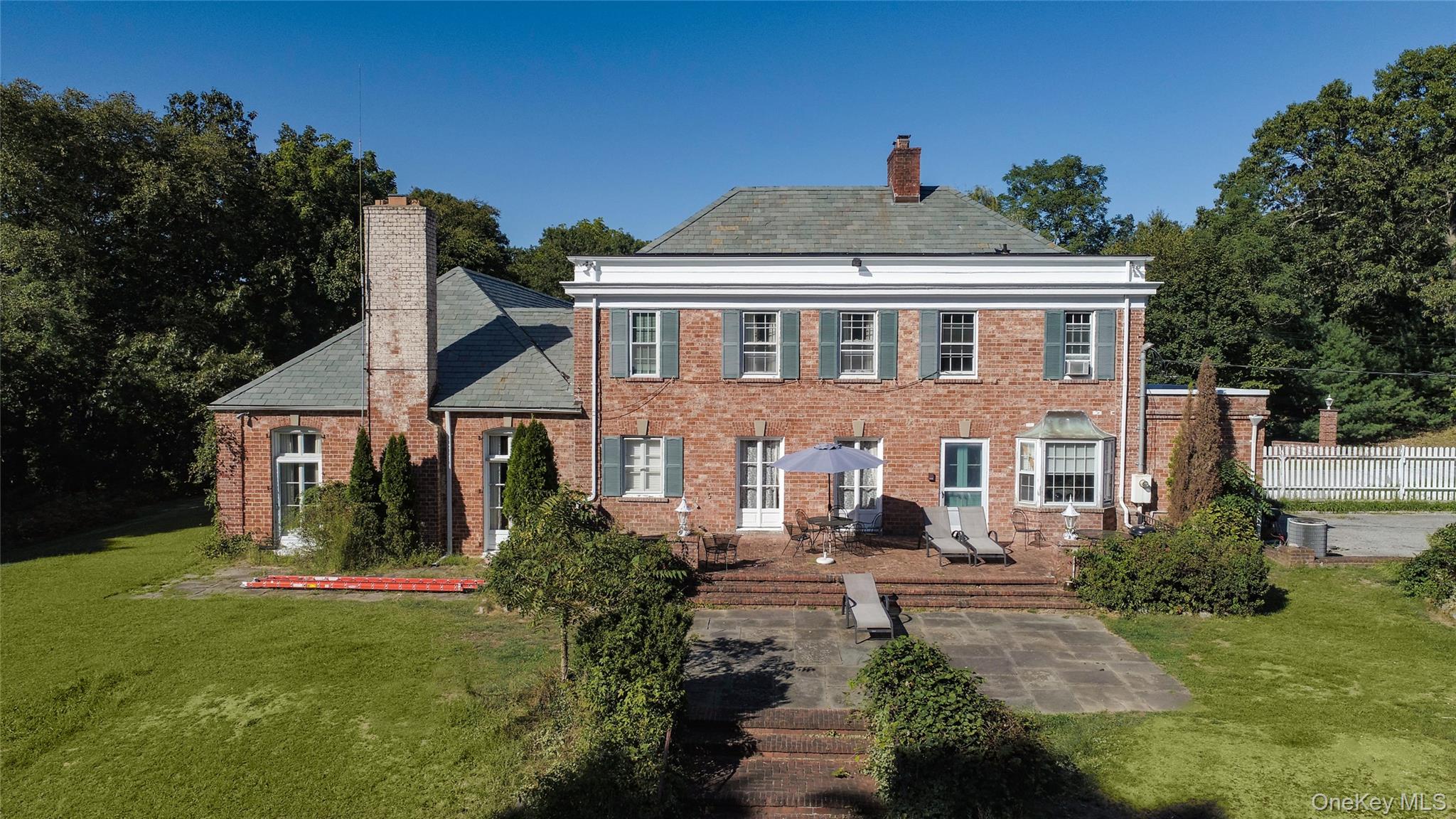 274 River Road St. James, NY 11780 - Photo 27 of 30 a front view of a house with a yard