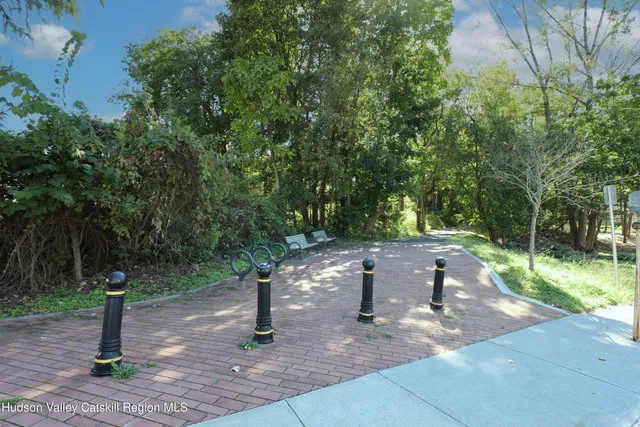 a bench sitting in the middle of a park
