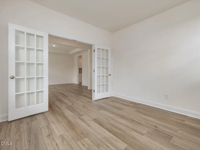 a view of a kitchen with a sink and a large window