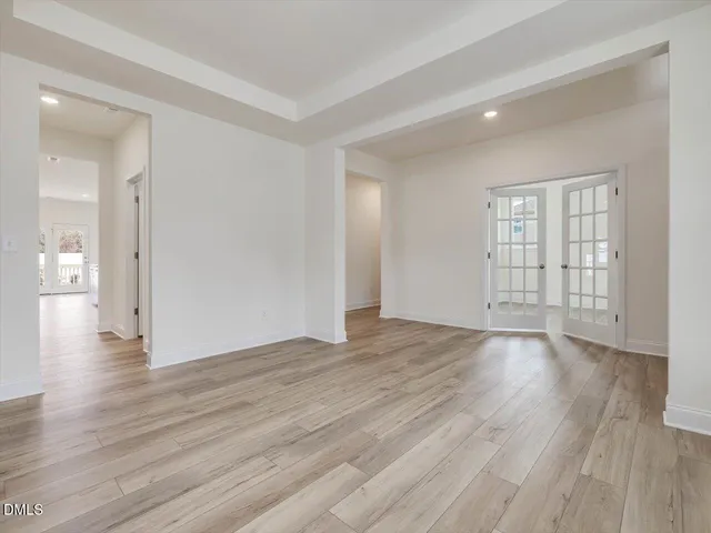 a kitchen with kitchen island a sink a stove a microwave and cabinets
