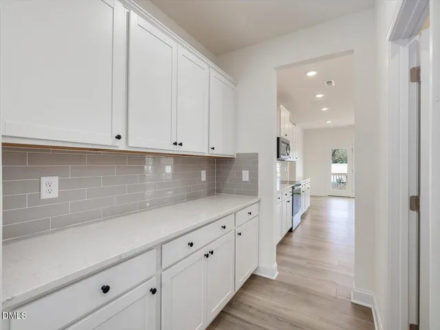 a kitchen with counter top space cabinets and stainless steel appliances