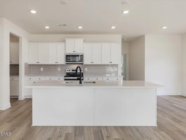a bathroom with a sink a toilet and a bathtub