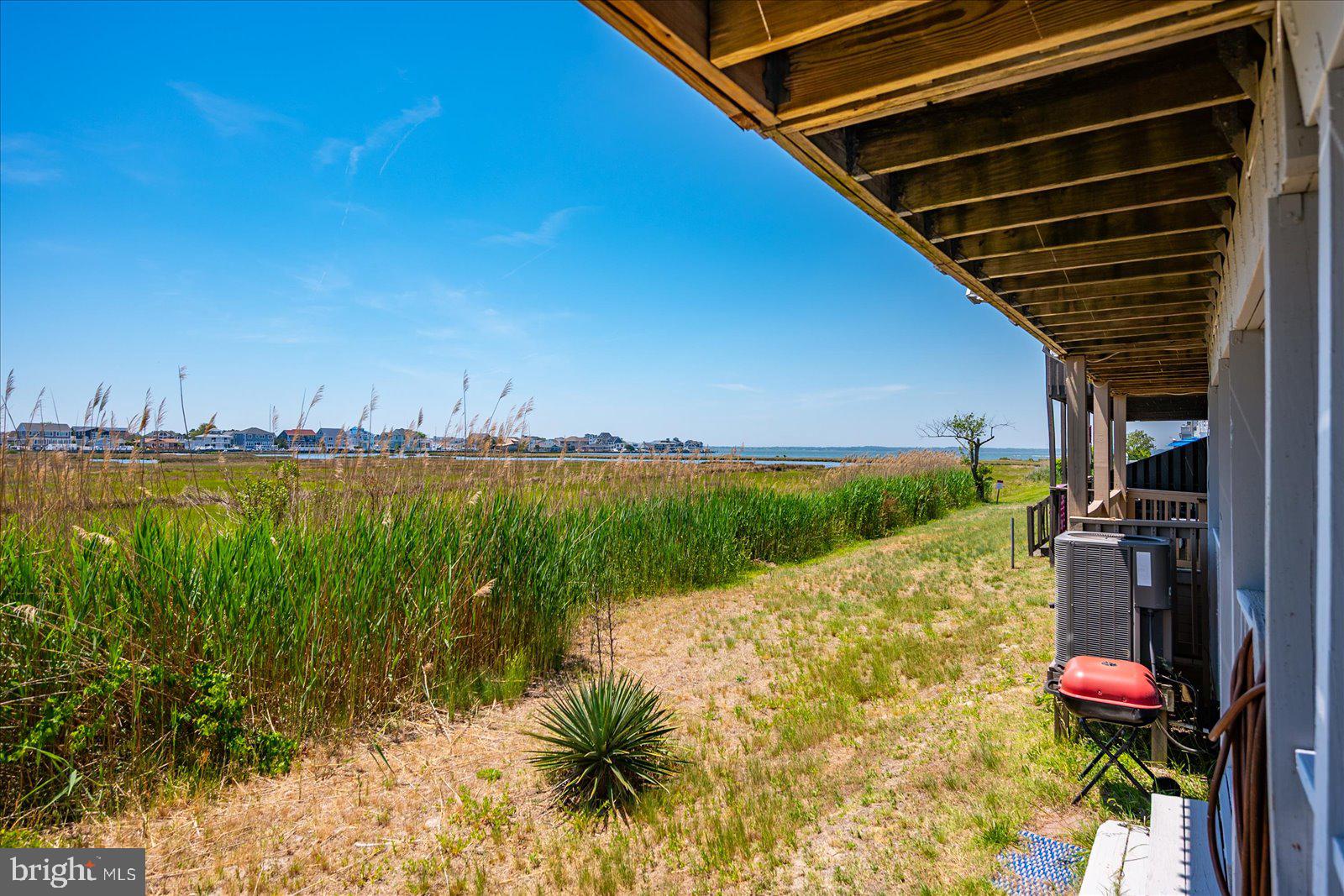135 Jamestown Road, Unit 18A Ocean City, MD 21842 - Photo 50 of 63 a view of a backyard of a house with lake view and a ocean view