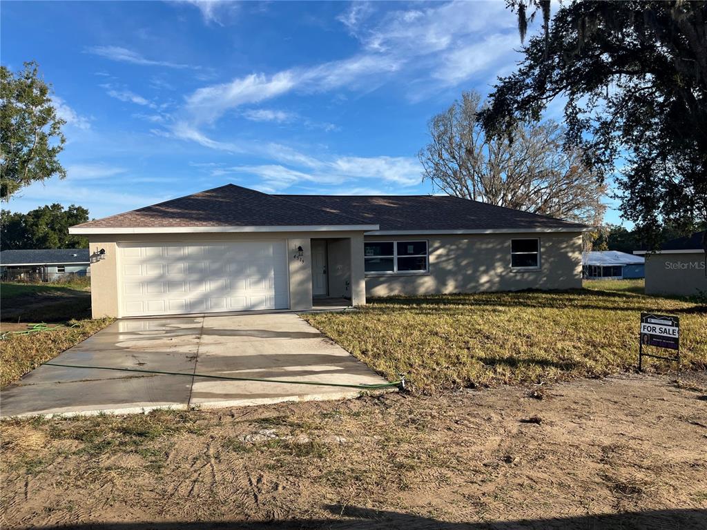 4519 East Walker Street Inverness, FL 34453 - Photo 1 of 8 a front view of a house with garden