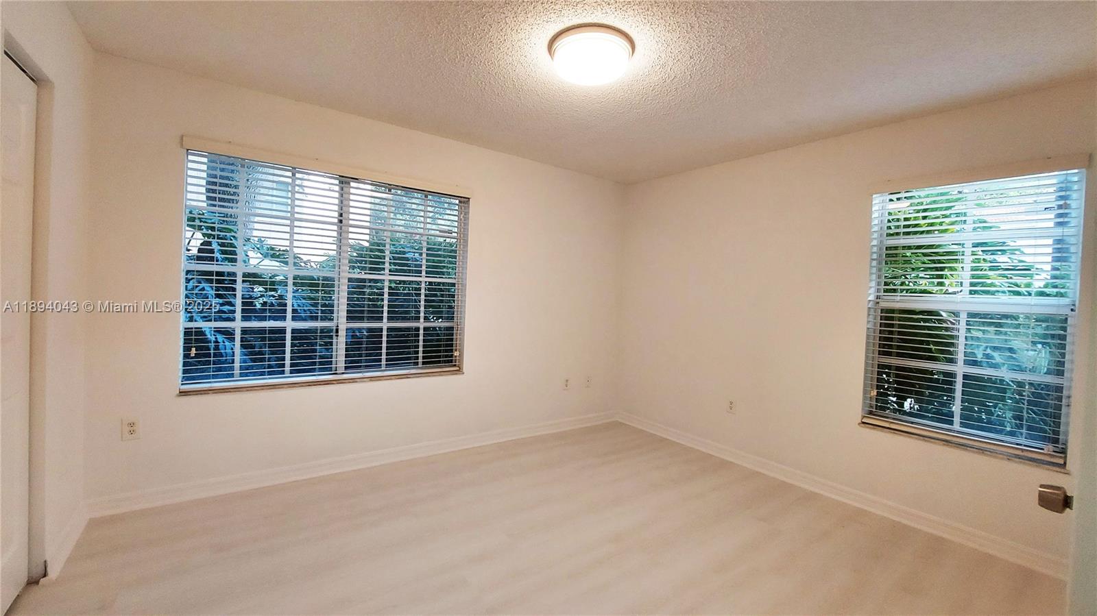 2457 Centergate Drive, Unit 108 Miramar, FL 33025 - Photo 14 of 18 a view of an empty room with a window