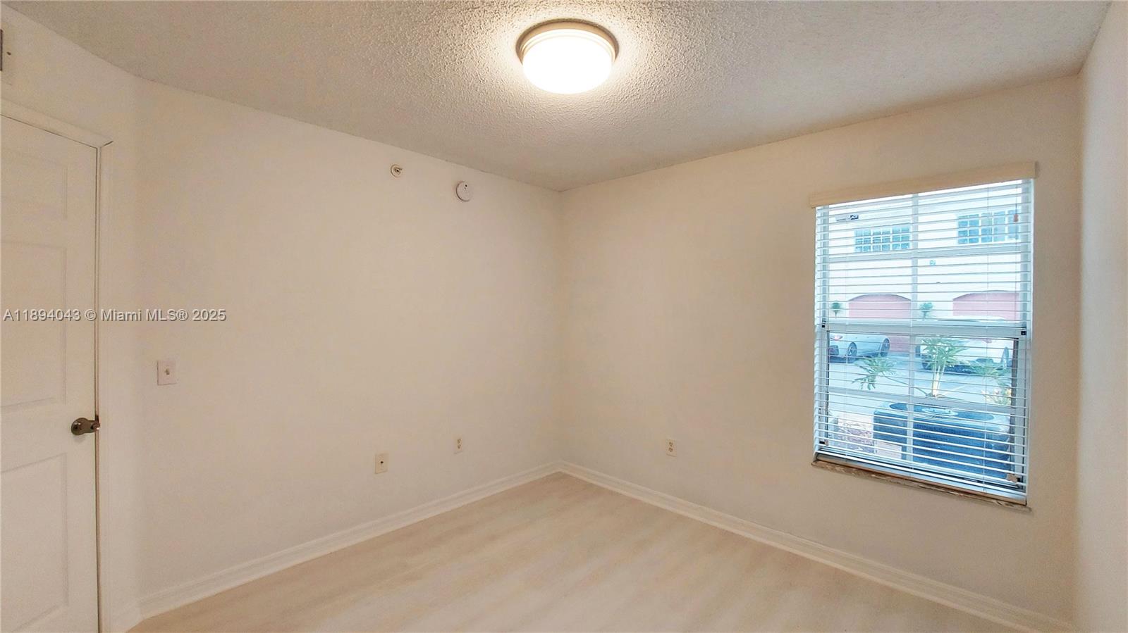 2457 Centergate Drive, Unit 108 Miramar, FL 33025 - Photo 16 of 18 an empty room with a window