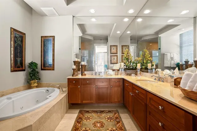 a large bathroom with a large tub and sink