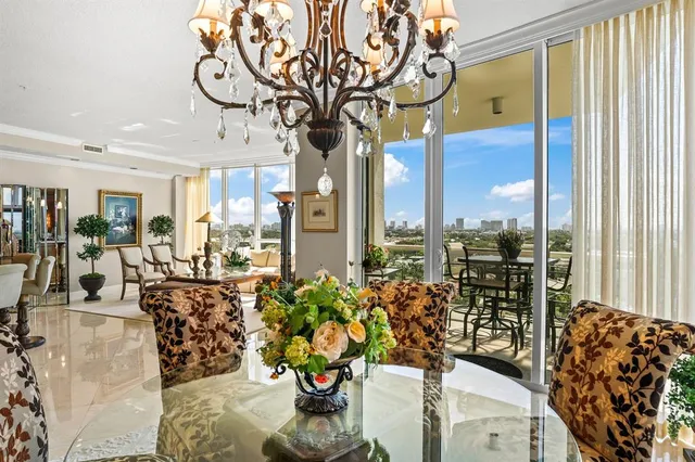 a living room filled with furniture and a large window