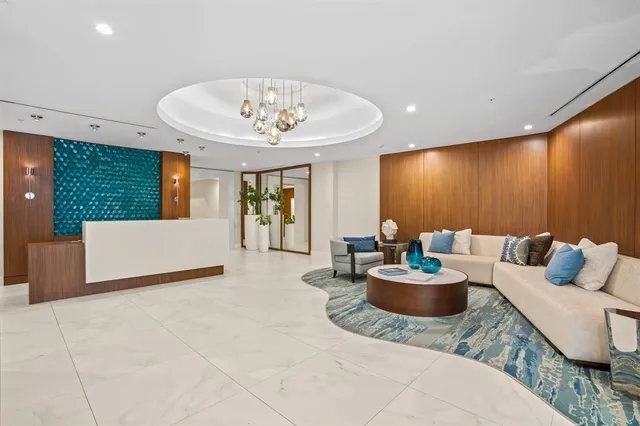 a living room with furniture and a table