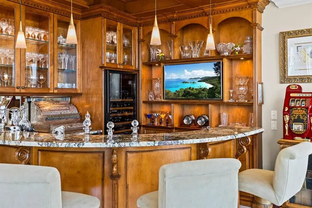 a dining table with chairs and window
