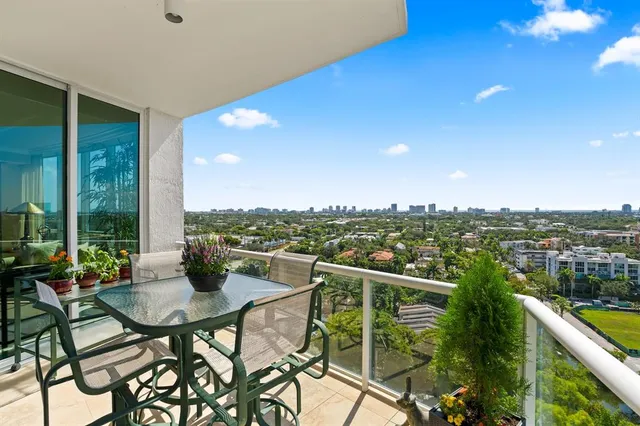 a view of a chairs and table in patio