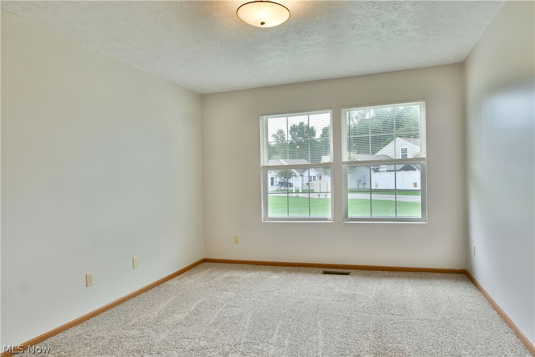 3287 Pheasant Run Road, Unit B Cortland, OH 44410 - Photo 8 of 45 Neutral wall color, carpeted flooring, and a flush mount ceiling light