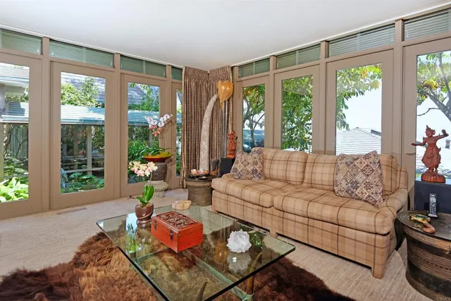 a view of a chairs and table in a patio