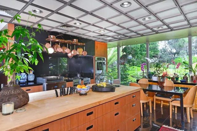 a kitchen with lots of counter top space and appliances