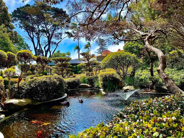 a wooden bench sitting in front of a building