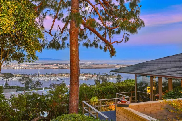 a bedroom with a bed and glass window