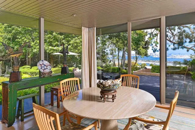 a outdoor dining space with furniture and garden view
