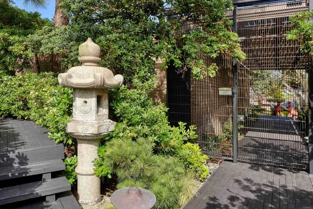 a living room with furniture gym equipment and a large window