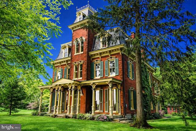 a view of a building with a yard