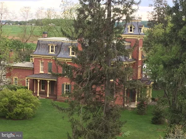 aerial view of a house with a yard