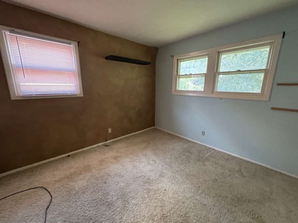104 East 19th Street Littlefield, TX 79339 - Photo 15 of 19 an empty room with windows