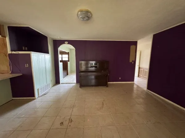 a large room with closet and windows
