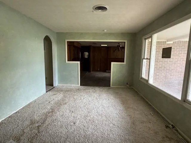 a view of an empty room with a window