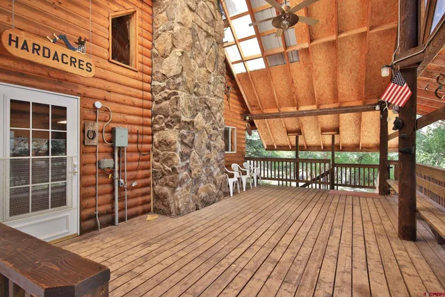 a balcony with wooden floor and window