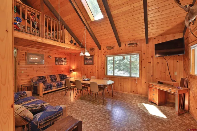 a bedroom with furniture and a wooden floor