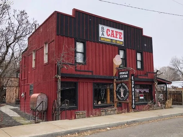 a view of a cafe with sitting area