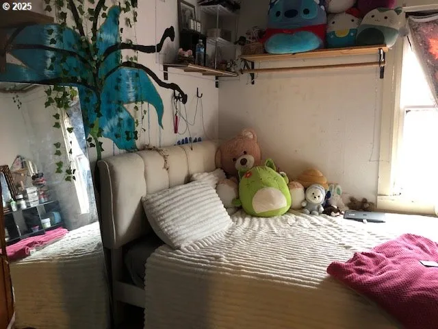 a view of a dining room with furniture and a window