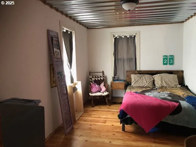 a bedroom with furniture and a window