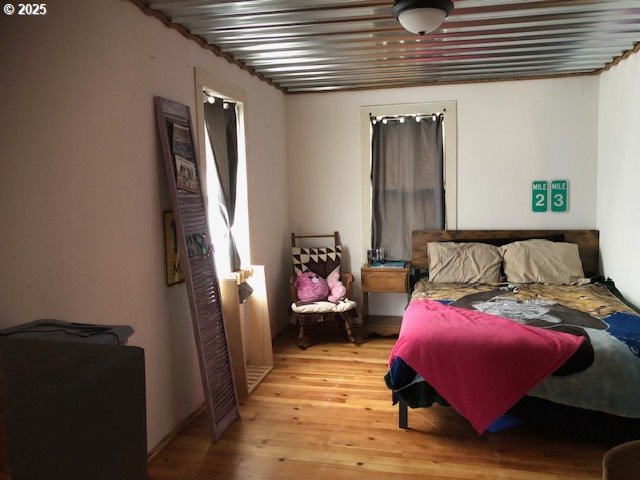 150 East Franklin Avenue Dayville, OR 97825 - Photo 15 of 33 a bedroom with furniture and a window