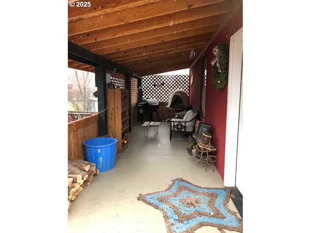 a view of a patio with iron fence