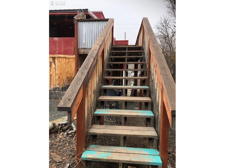 150 East Franklin Avenue Dayville, OR 97825 - Photo 21 of 33 a view of staircase with white walls and a window