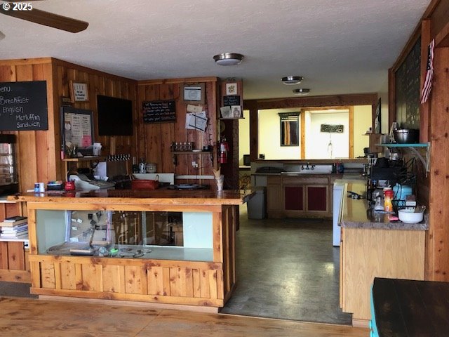 150 East Franklin Avenue Dayville, OR 97825 - Photo 24 of 33 a view of a kitchen with stainless steel appliances granite countertop a stove and cabinets