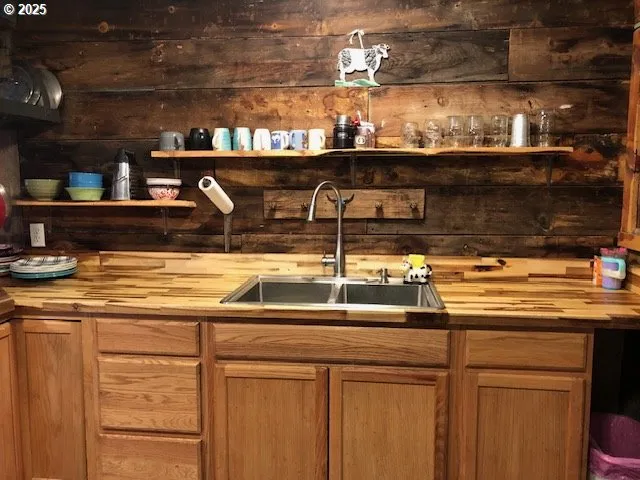a kitchen with a sink and cabinets