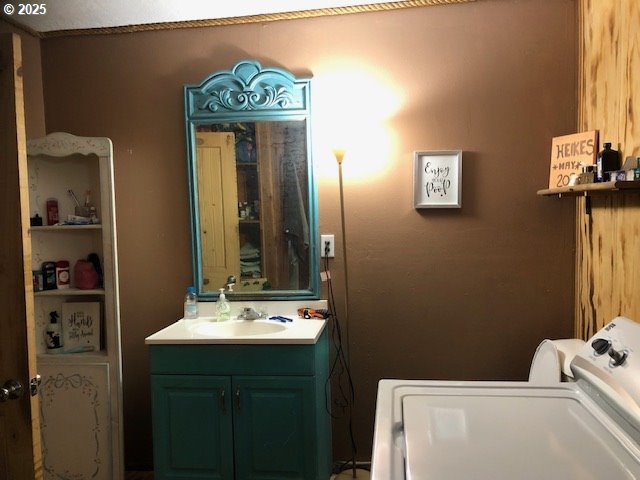 150 East Franklin Avenue Dayville, OR 97825 - Photo 9 of 33 a bathroom with a sink a mirror and a toilet