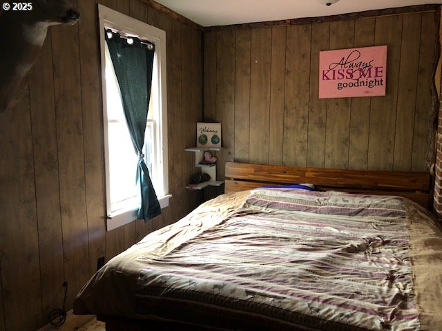 150 East Franklin Avenue Dayville, OR 97825 - Photo 10 of 33 a bedroom with a bed and a window