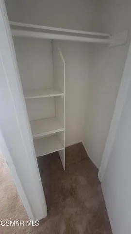 a view of a swimming pool with a yard